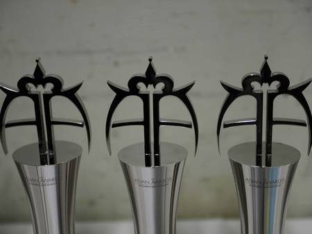 Awards ceremony stage and guest tables produced by Refine Events